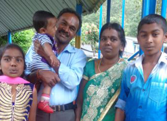 Thangam, Vijayasundaram, and their three children in Sri Lanka.