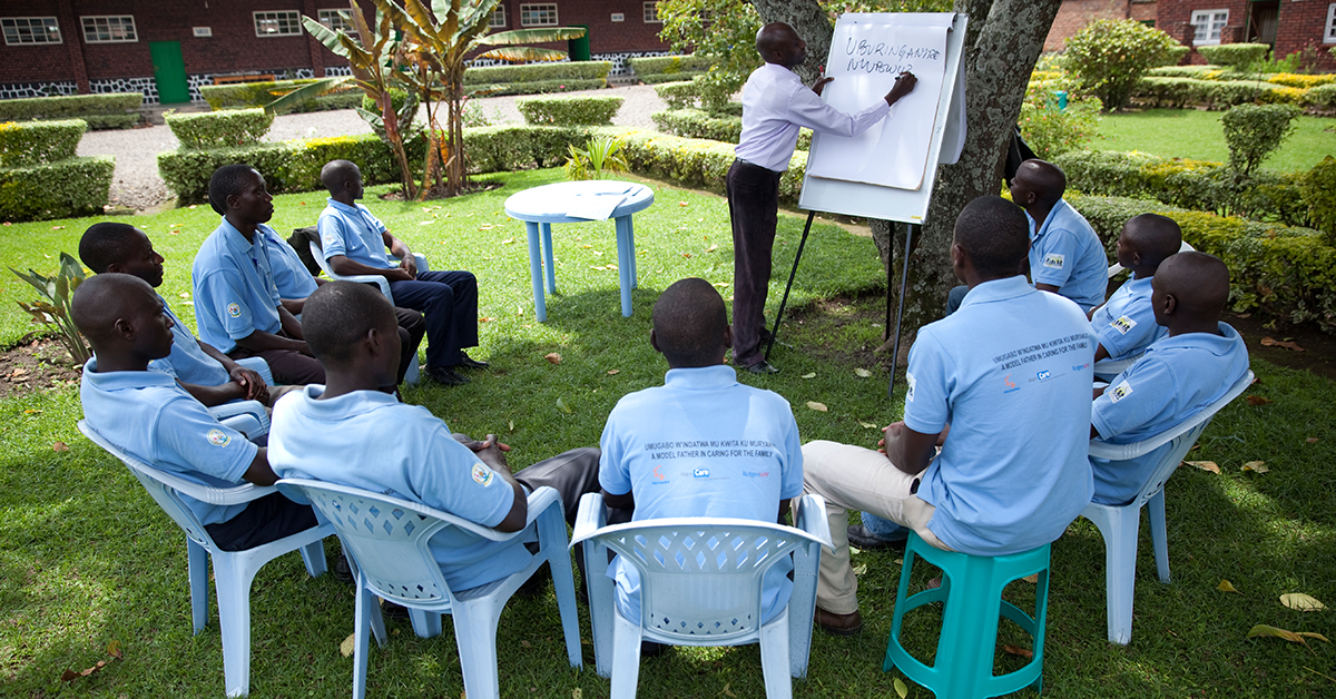 Men participate in a MenCare+ fathers' group session in Rwanda.