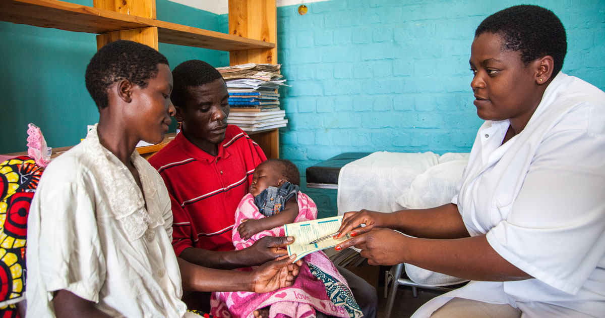A couple and child with a health professional in Rwanda. Photo by Perttu Saralampi for Equimundo.